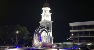 Queen Victoria Memorial Clock Tower Illuminated at Night